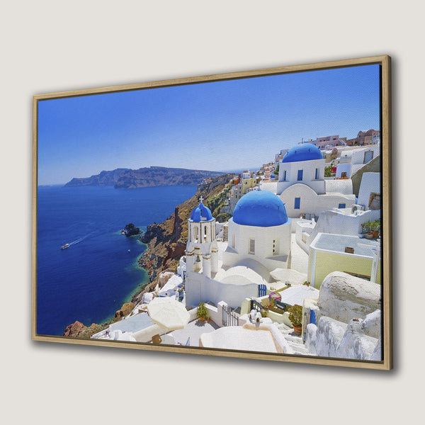Framed Wall Art of Santorini, Greece. Capture the beauty of blue domes and white buildings. Coastal landscape art in blue, white, and earth tones.