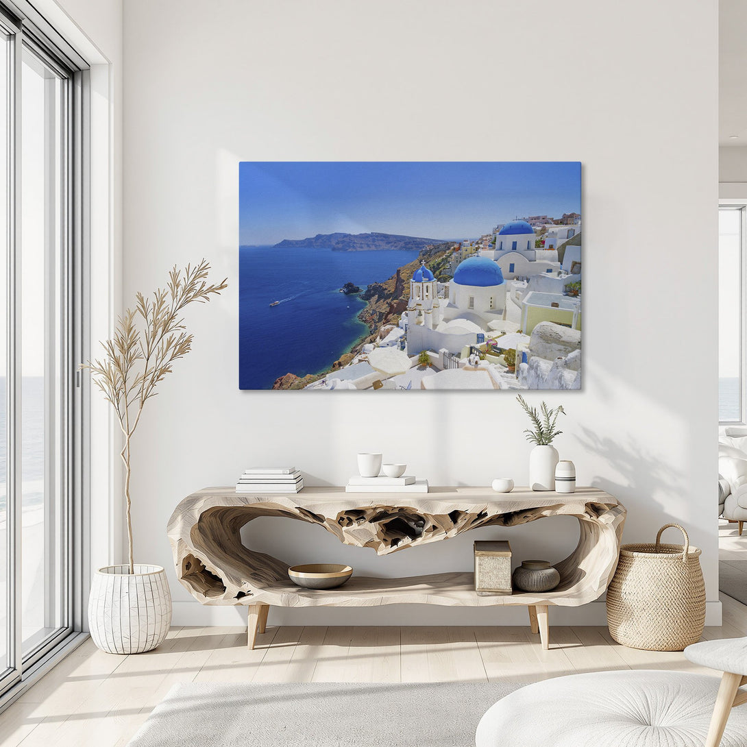 Framed Wall Art featuring Santorini, Greece. Blue and white buildings against a vibrant blue sky. Coastal landscape Canvas Print, perfect for home decor.