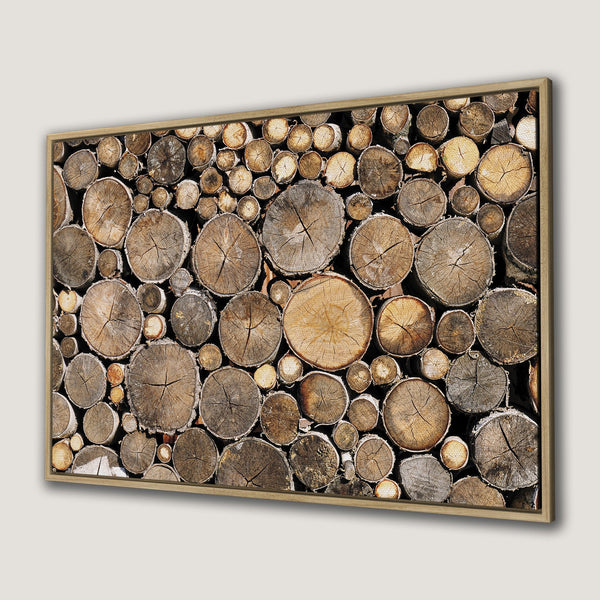 Framed Wall Art featuring a rustic wood log pile. Warm, earthy tones create a cozy, natural aesthetic. Perfect for adding a touch of nature to your space.