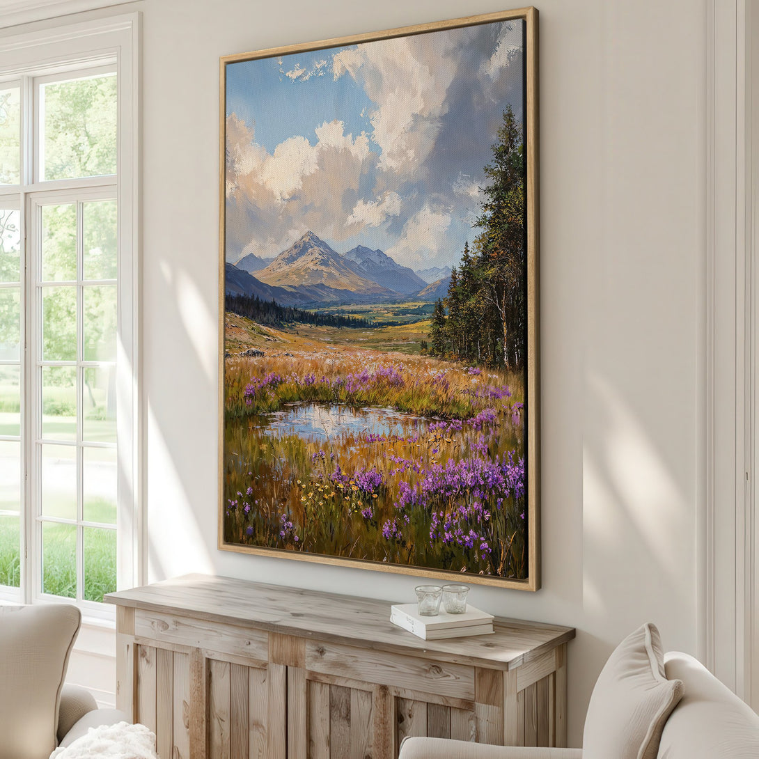 Framed Wall Art: Landscape painting with mountains, pond, and wildflowers. Earthy tones with pops of purple and blue. Perfect for adding a touch of nature.