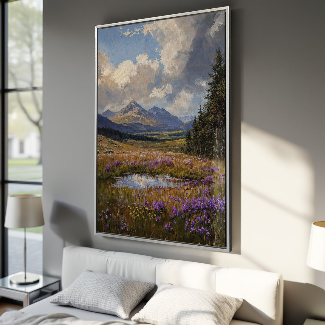 Framed Wall Art: Landscape painting with mountains, meadow, and pond in a bedroom. Impressionistic style, featuring blue, green, and purple hues.