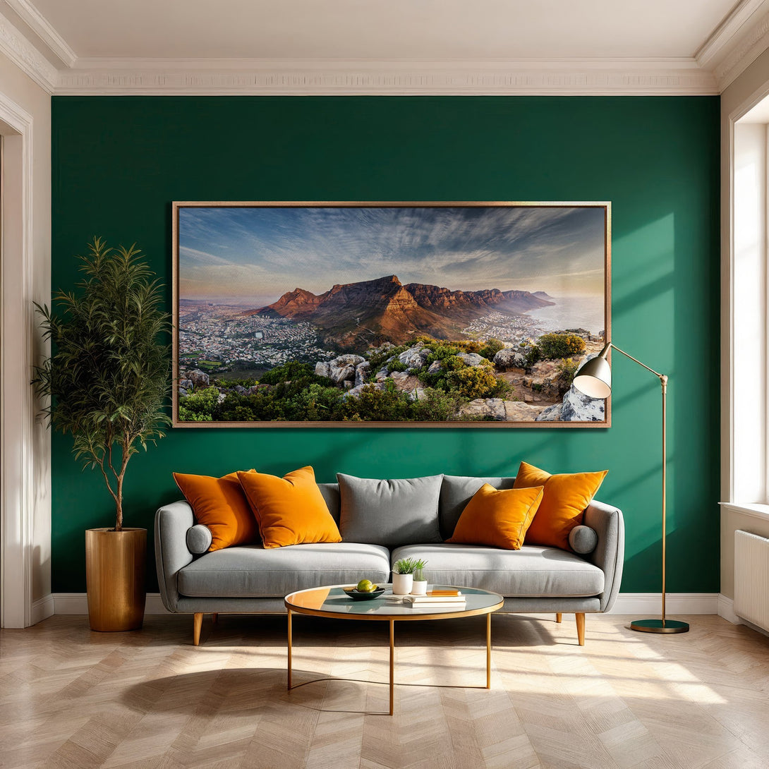 Framed Wall Art: Mountain landscape canvas print in a modern living room. Earthy tones with green and orange accents. Elevate your home decor!