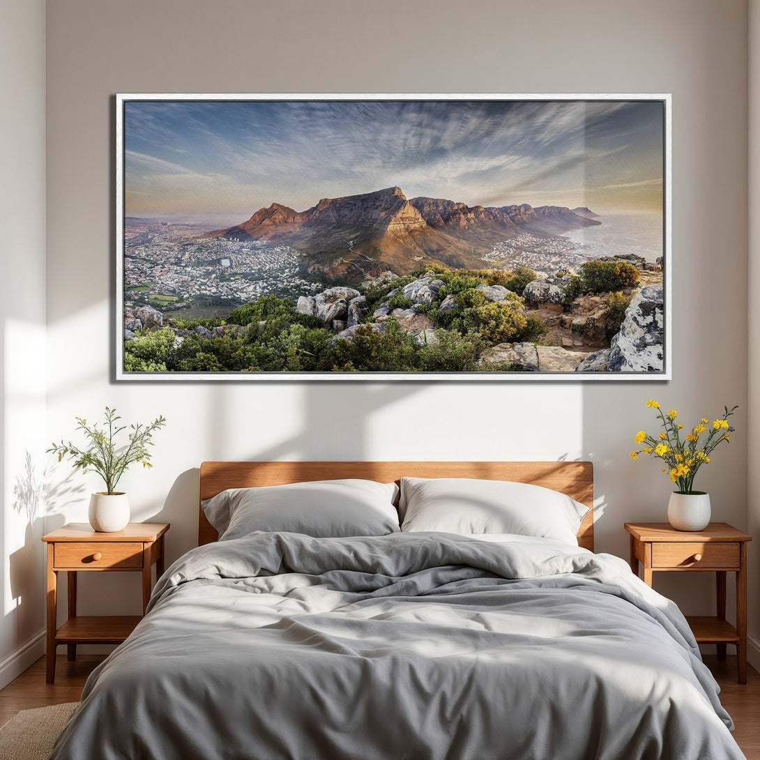 Framed Wall Art of Table Mountain landscape in a bedroom. Featuring a vibrant blue sky, warm earth tones, and lush greenery. Perfect for modern decor.
