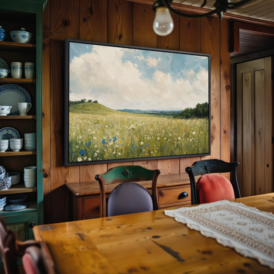 Framed Wall Art Canvas Print of a serene field landscape in a rustic interior. Soft greens, blues, and yellows create a calming, vintage-inspired aesthetic.