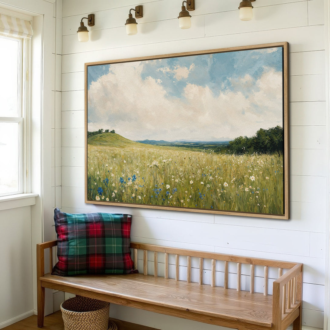 Framed Wall Art: Landscape Canvas Print in a farmhouse interior. Features a field of wildflowers in green, blue, and cream with a blue sky. Perfect for home decor.