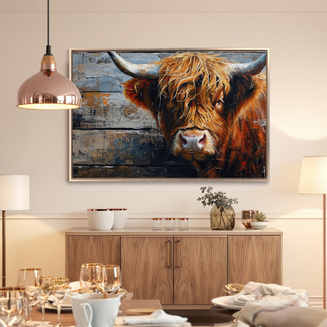 Framed Wall Art of a Highland cow in warm orange and blue tones. Rustic painting style, perfect for farmhouse decor.