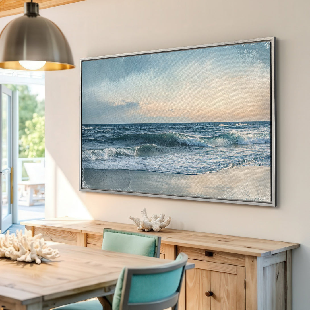 Framed Wall Art: Coastal Canvas Print of ocean waves in blue and beige tones. Perfect for beach house decor and adding a calming touch to your home.