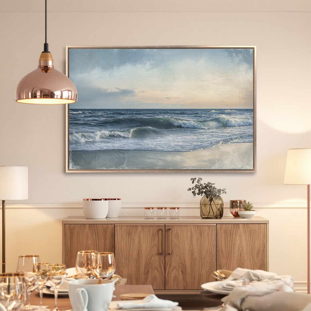 Framed Wall Art: Serene ocean waves canvas print in calming blue and neutral tones. Perfect coastal wall decor for a tranquil living space.
