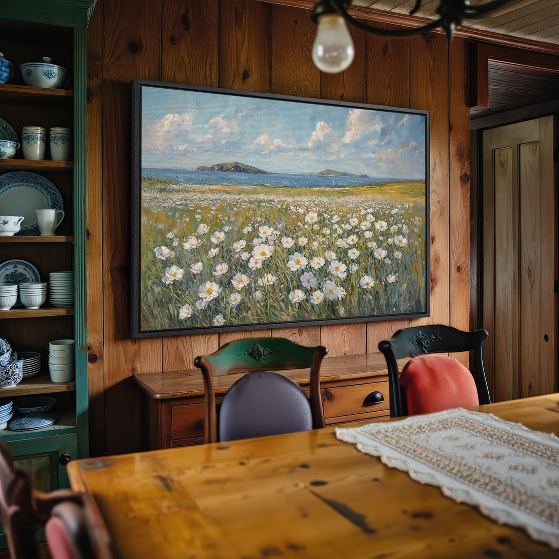 Framed Wall Art: Coastal landscape Canvas Print with white flowers, blue sky, and green hills. Perfect for adding a touch of nature to your home.