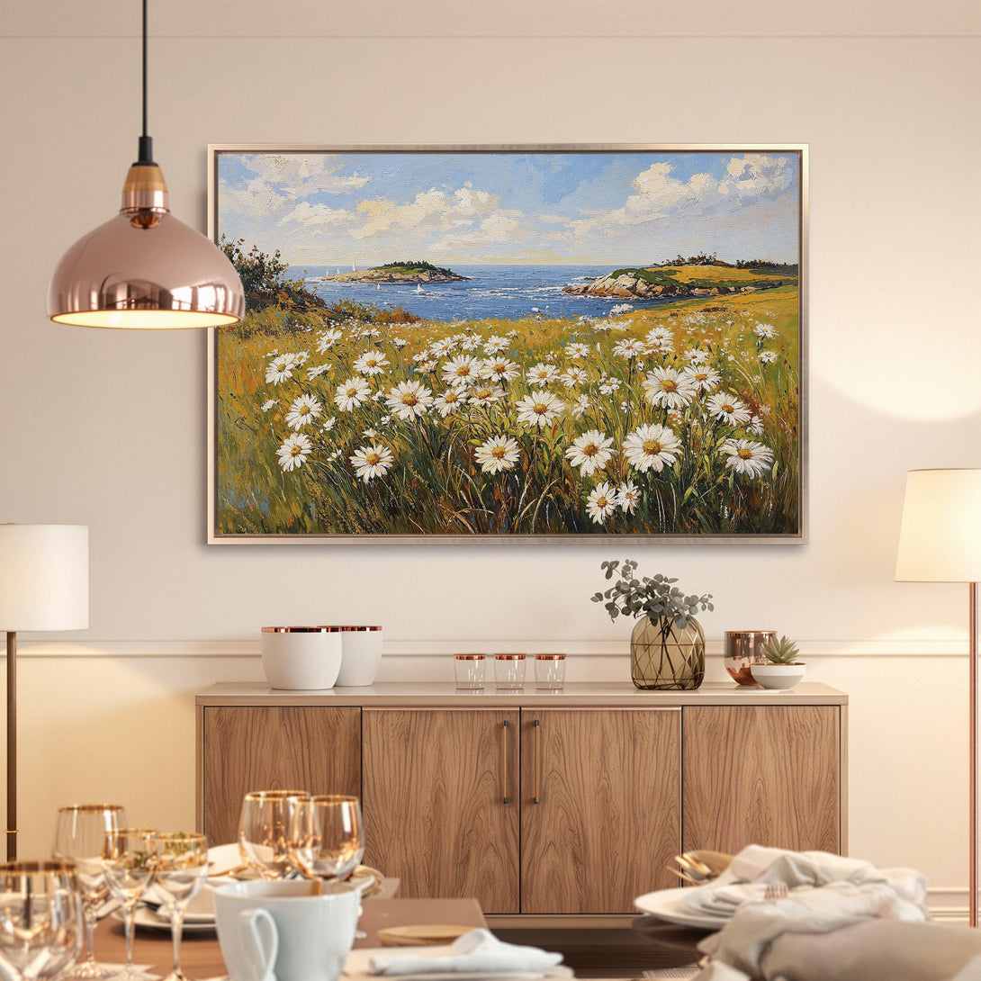 Framed Wall Art: Coastal daisy field canvas print. Impressionist style painting with blue, yellow, and white color palette. Perfect for adding a touch of nature.