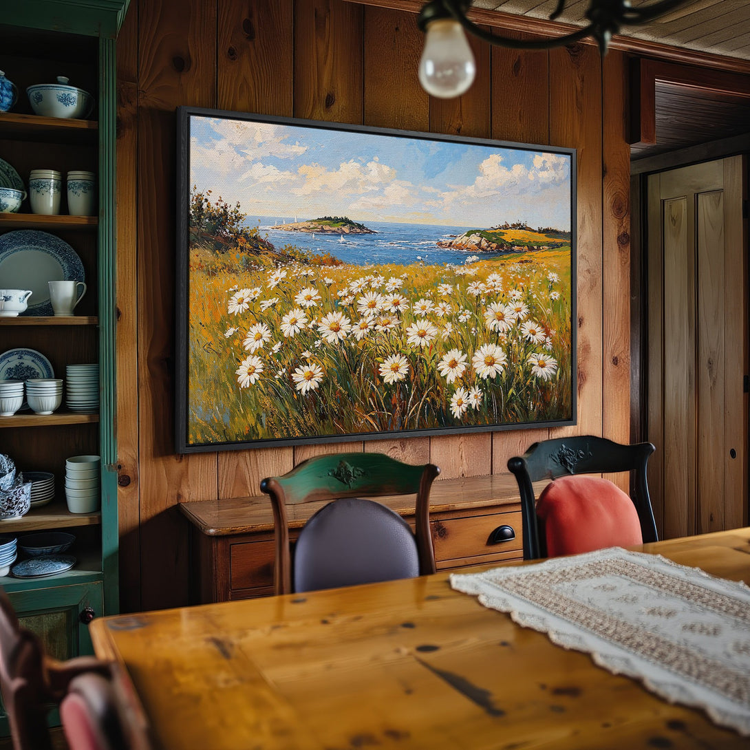 Framed Wall Art: Coastal daisy field painting in a warm, inviting interior. Features a blue, yellow, and white color palette. Perfect for adding a touch of nature.