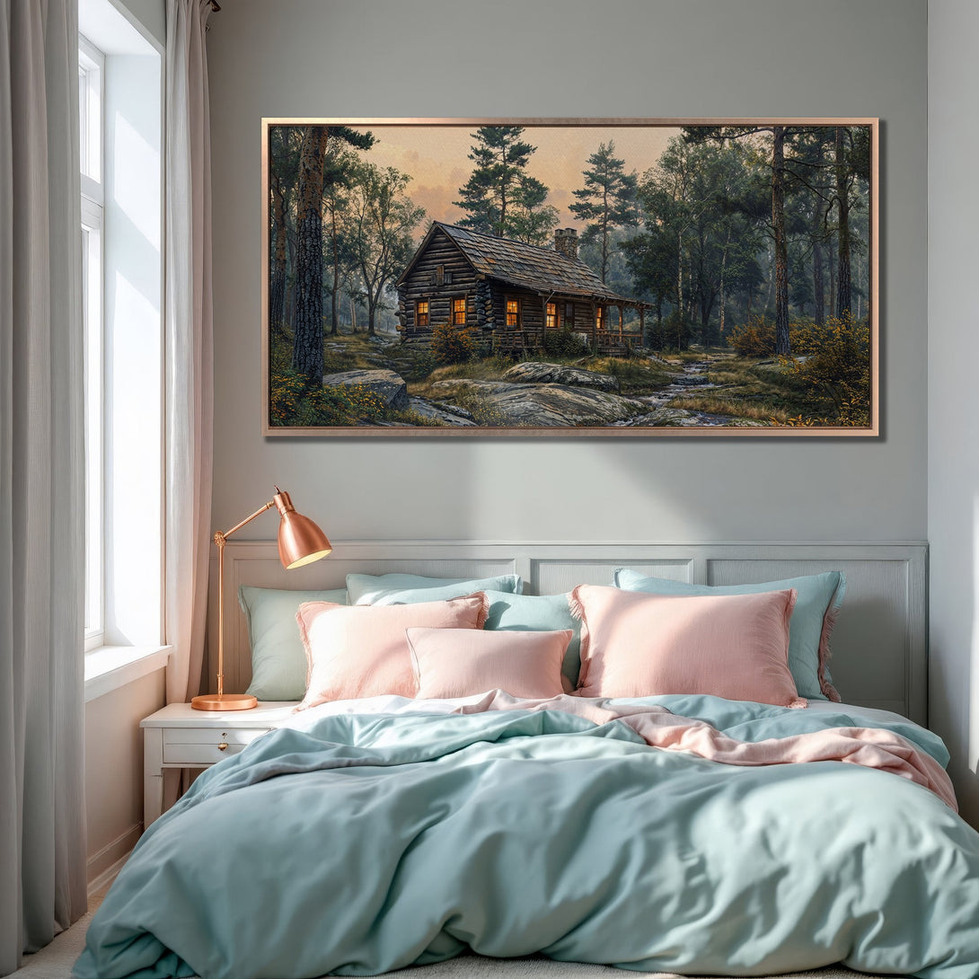Framed Wall Art featuring a cozy cabin in a forest scene. Earthy tones with a touch of green and gold, perfect for adding warmth to any room.