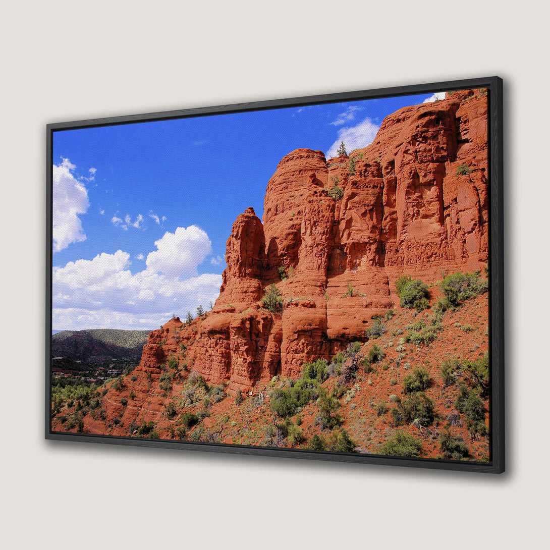 Framed Wall Art: Stunning desert landscape Canvas Print featuring red rock formations under a bright blue sky. Perfect for adding a pop of color and natural beauty!