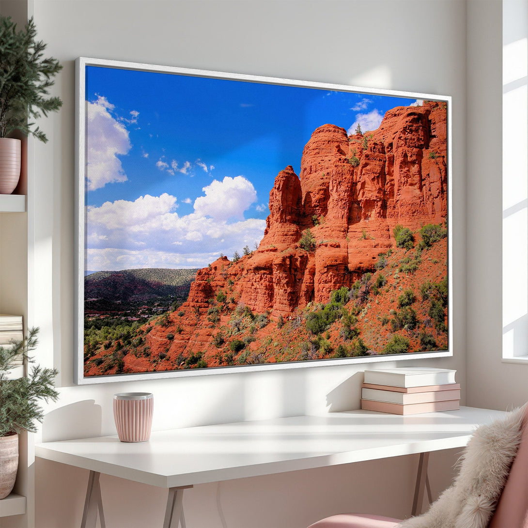 Canvas Print of a stunning red rock landscape with blue sky and white clouds. Warm, earthy tones bring the beauty of nature indoors.