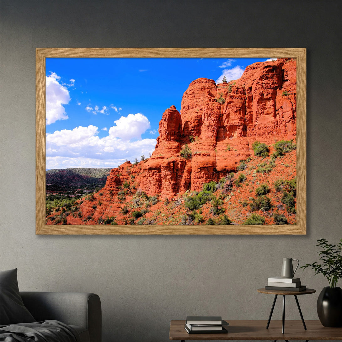 Framed Poster of stunning red rock landscape with blue sky and white clouds. Perfect wall art for your home.