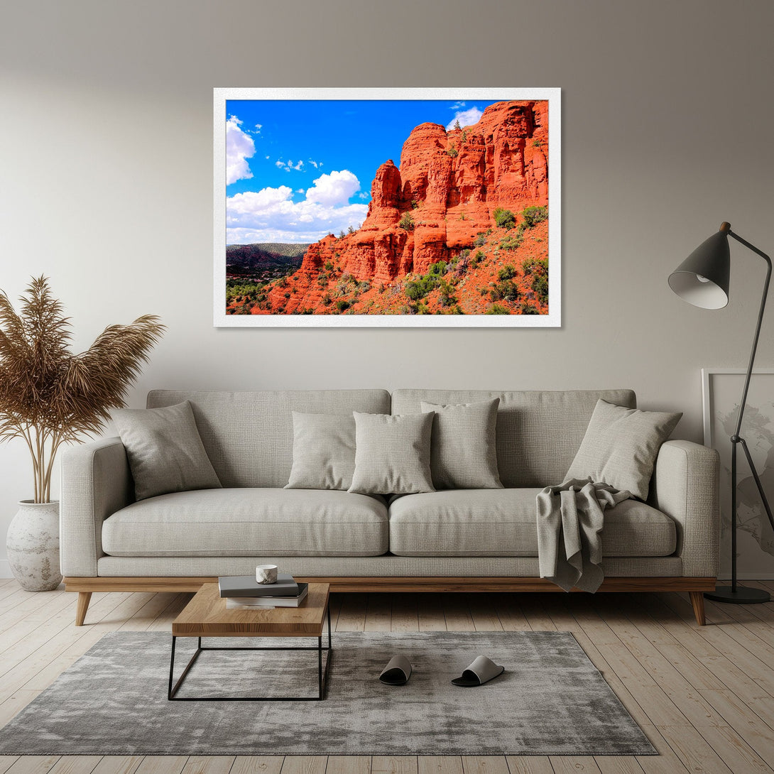Framed Poster featuring a stunning red rock landscape under a blue sky. Earthy tones and modern style for your home decor.