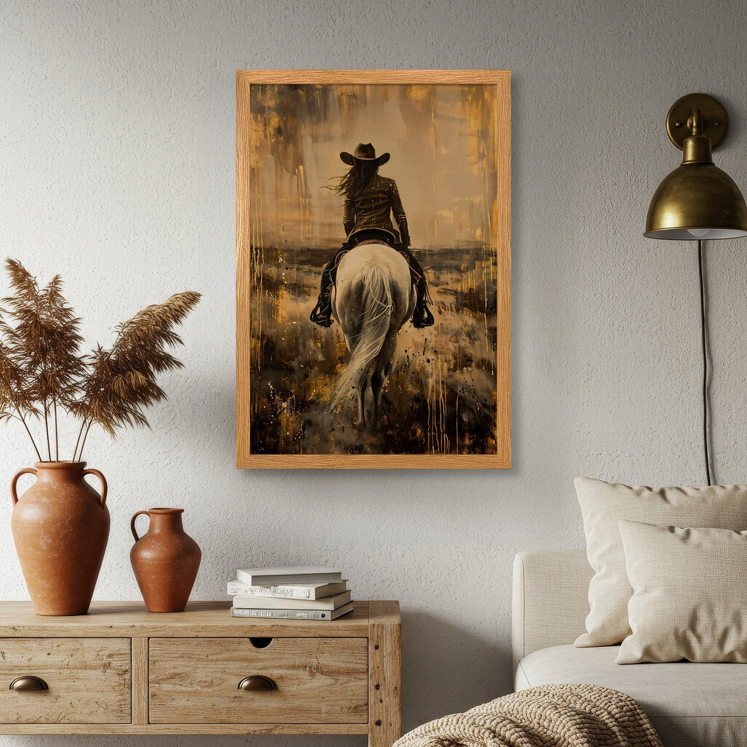 Framed Poster featuring a cowgirl on horseback, painted in a rustic style with a warm, earthy color palette. Perfect western wall art.