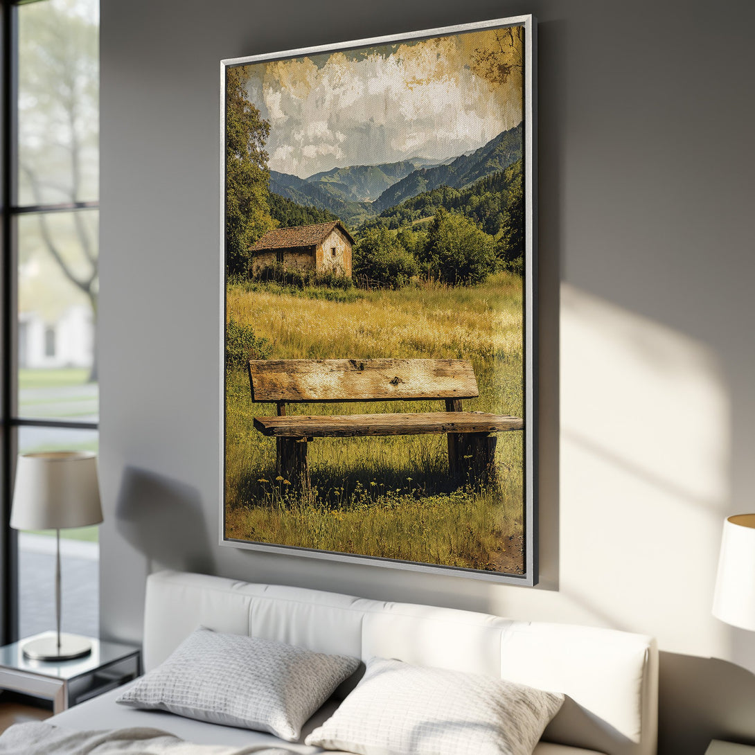 Framed Wall Art: Rustic landscape Canvas Print featuring a bench, cabin, and mountains in a warm, earthy color palette. Perfect for adding a cozy touch!