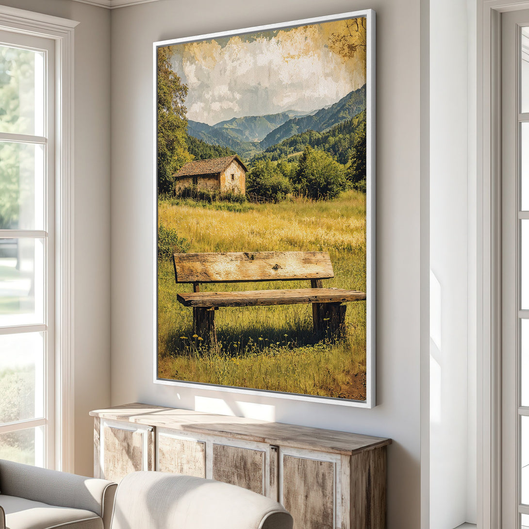 Framed Wall Art featuring a rustic landscape with a bench, mountains, and a cabin. Warm, earthy tones create a cozy, vintage feel. Perfect for home decor.