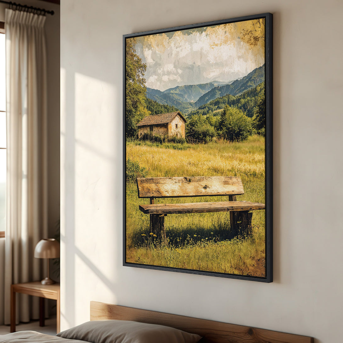 Framed Wall Art: Rustic landscape Canvas Print with a bench, cabin, and mountains in a warm, earthy color palette. Perfect for adding a cozy touch!