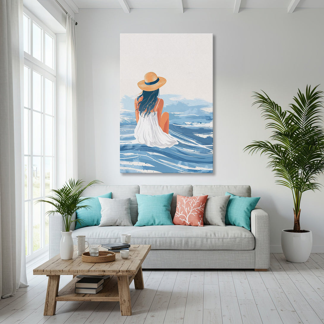 Framed Wall Art: Coastal scene Canvas Print in blue & white. Featuring a woman at the beach. Perfect for modern decor.