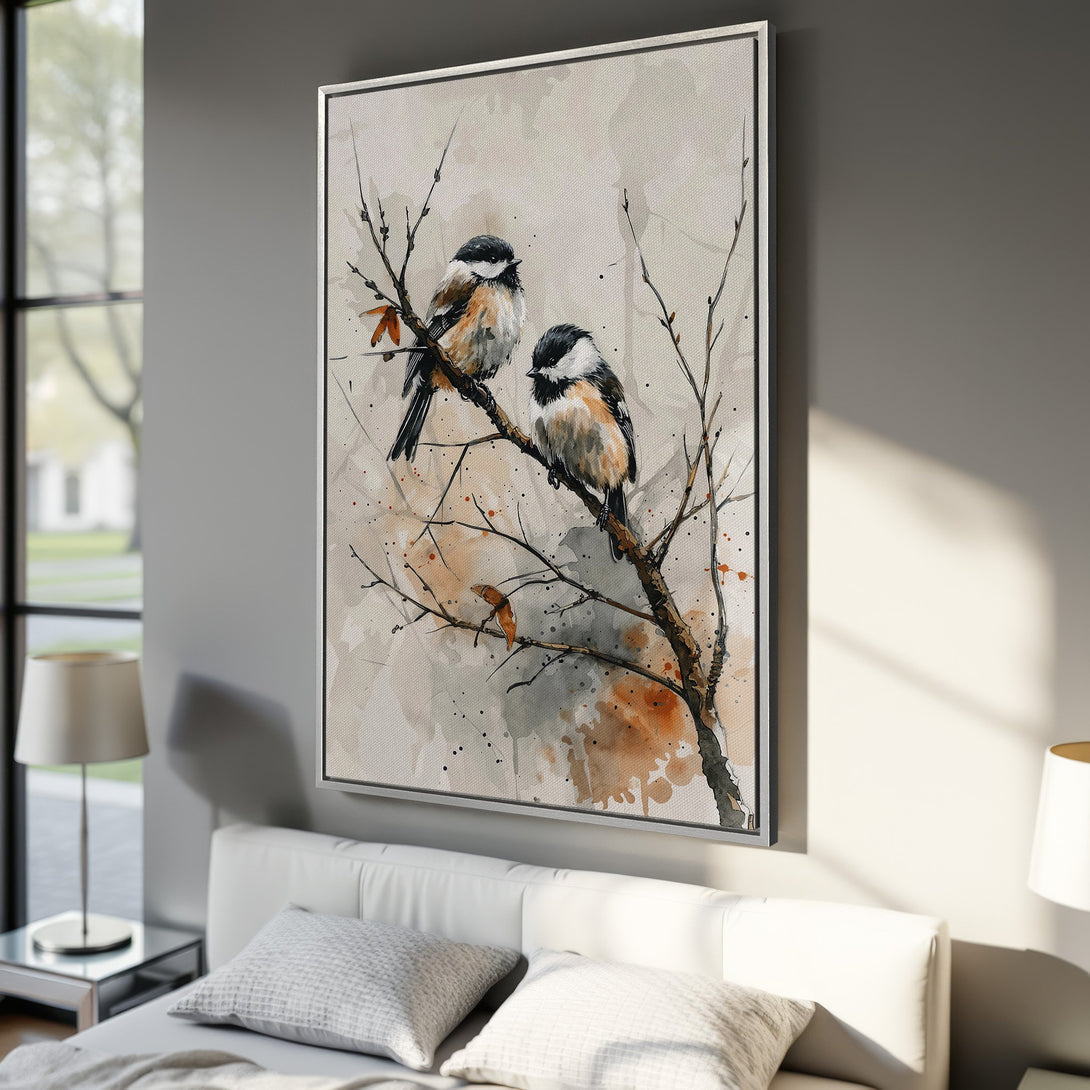 Framed Wall Art featuring watercolor-style birds on a branch. Neutral palette with pops of orange. Perfect for adding a touch of nature to your bedroom decor.