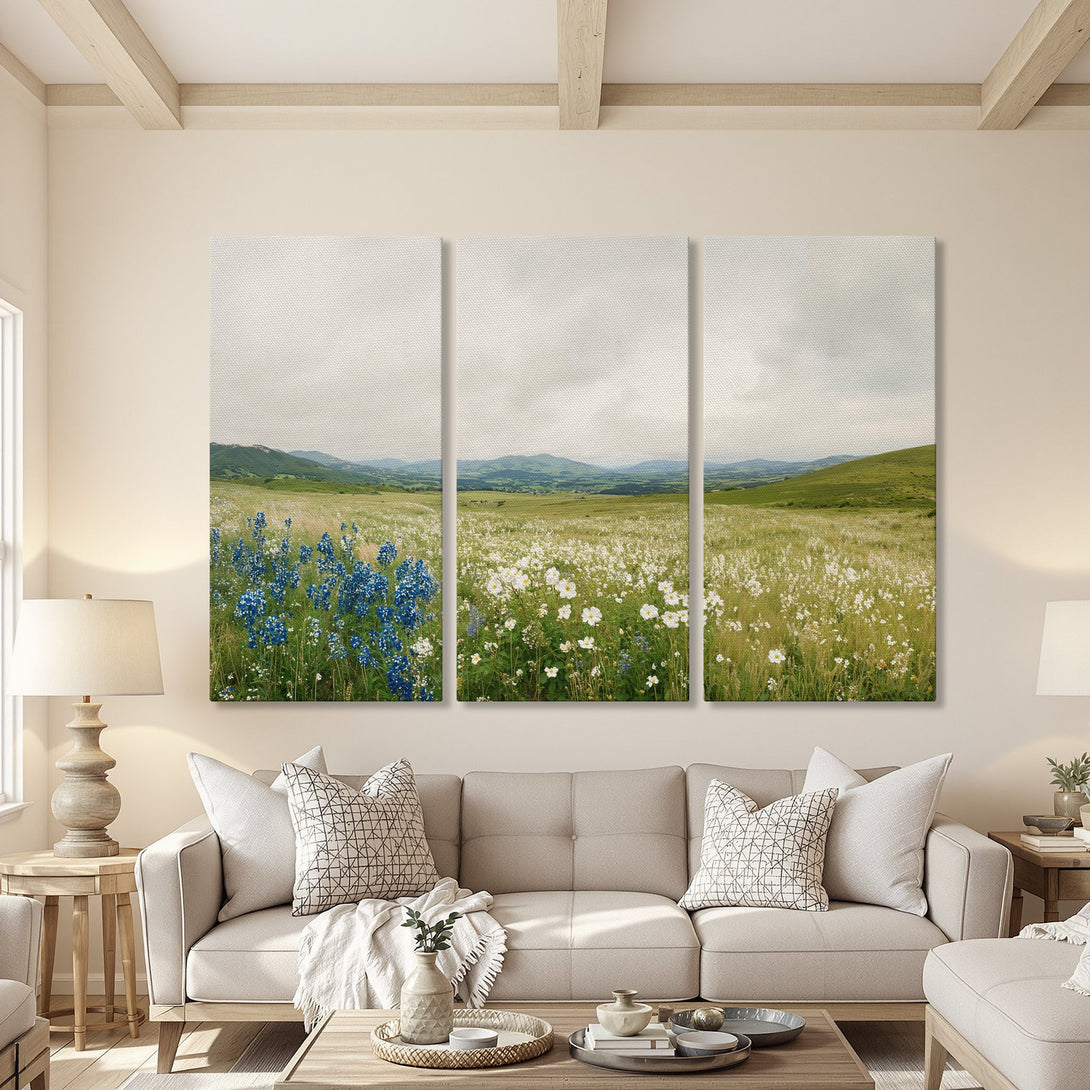 Canvas Print of a serene wildflower field in a soft, neutral living room. Features blue and white flowers with a green and beige palette.