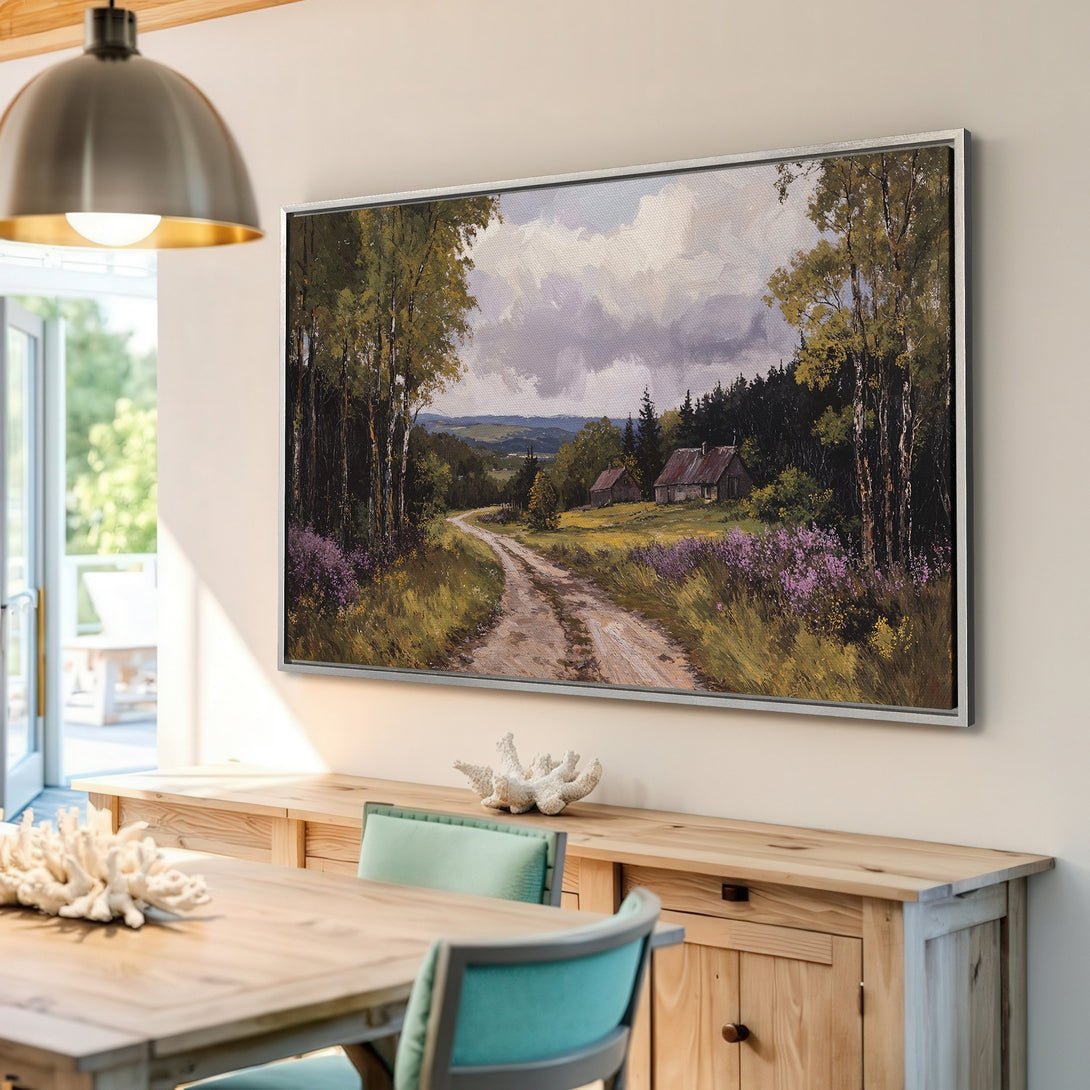Framed Wall Art featuring a serene landscape painting with a dirt road, trees, and houses. Earthy tones and a classic style for your home decor.