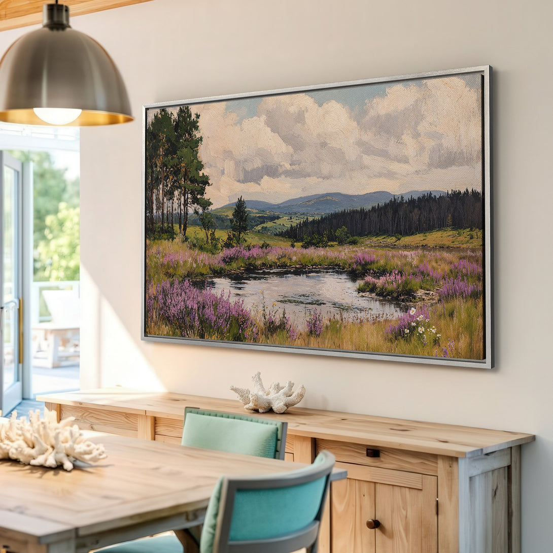 Framed Wall Art: Landscape painting in a serene style, featuring a pond and purple flowers. Earthy tones with pops of green and blue. Perfect for any home.