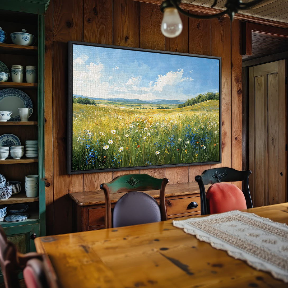 Framed Wall Art: Landscape Canvas Print featuring a field of wildflowers in a serene, impressionistic style with a blue, green, and yellow color palette.