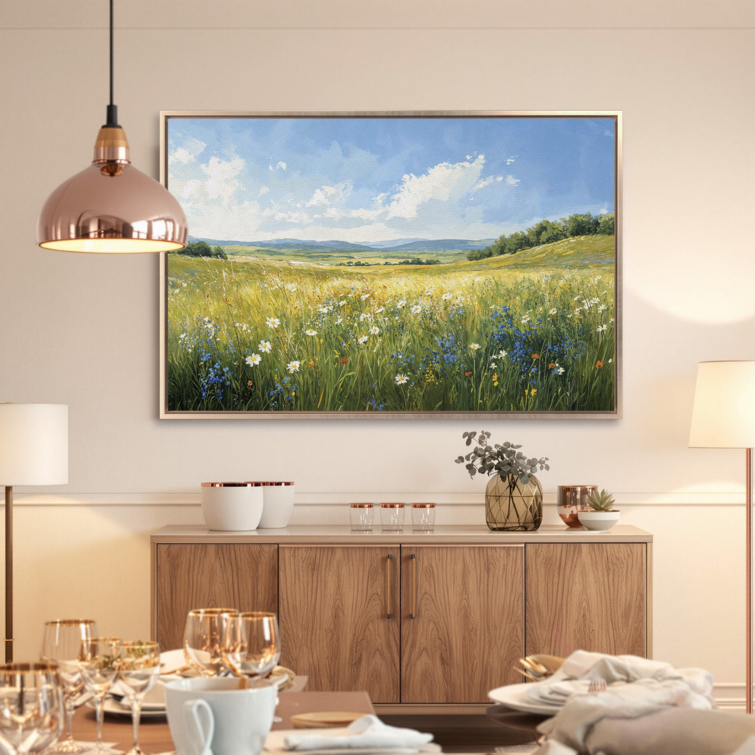 Framed Wall Art: Landscape painting of a field with wildflowers. Earthy tones with blue sky. Perfect for adding a touch of nature to your home.
