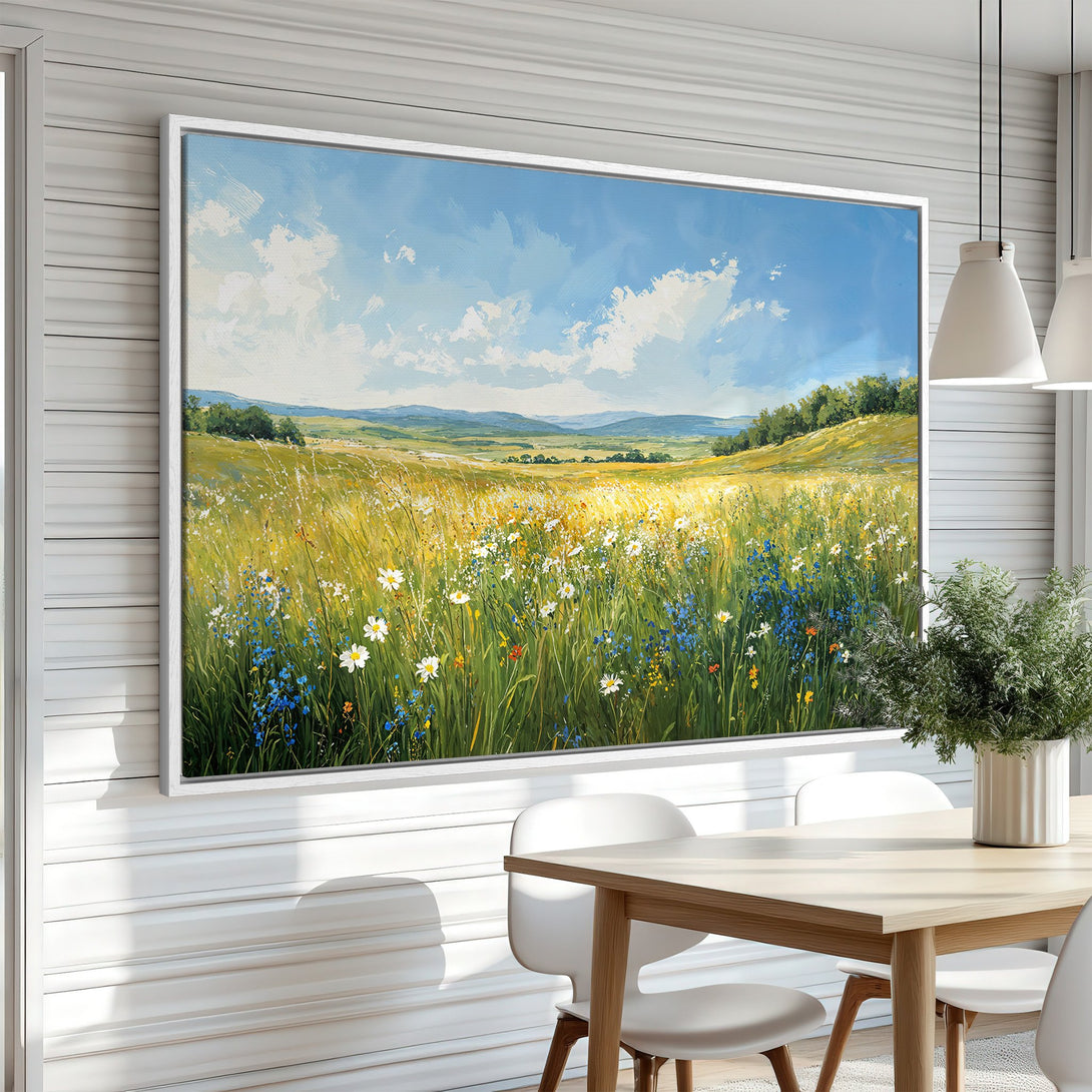 Framed Wall Art of a vibrant meadow landscape in a bright, impressionistic style. Features a blue sky, green fields, and colorful wildflowers. Perfect for home decor.