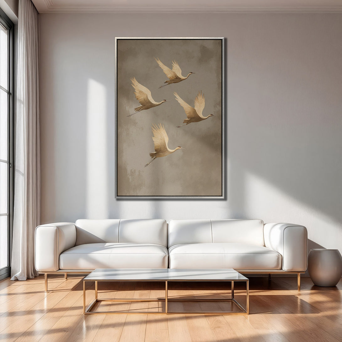 Framed Wall Art featuring flying cranes in muted beige tones. Modern Canvas Print adds a touch of nature and elegance to any interior.