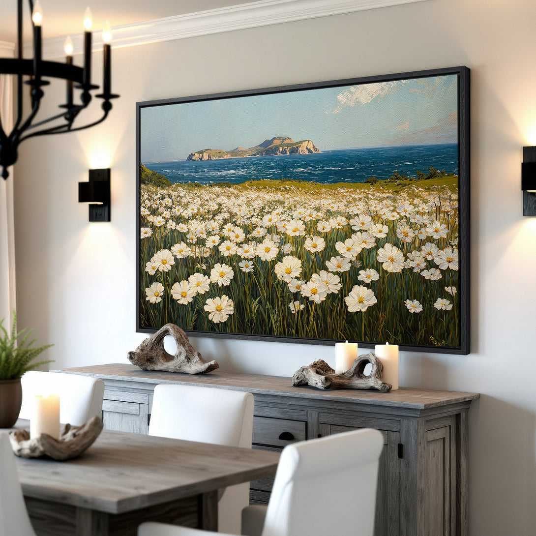 Framed Wall Art of a coastal landscape with white flowers and ocean. Beautiful blue, green, and white color palette. Perfect for adding a touch of nature to your home.