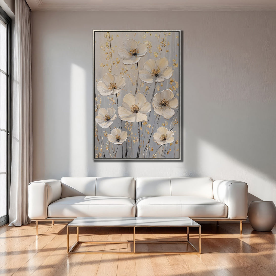 Framed Wall Art: Elegant floral canvas print in neutral tones, perfect for modern living rooms. Featuring white flowers, gold accents, and a gray background.