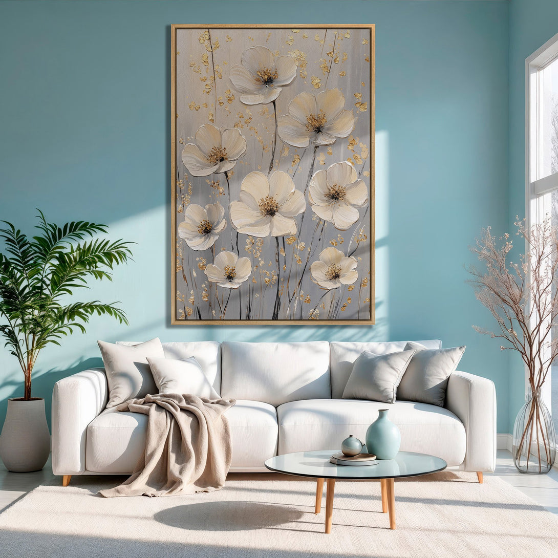 Framed Wall Art: Elegant floral Canvas Print in neutral tones, adding a touch of nature to a modern living room with a calming blue and gold palette.