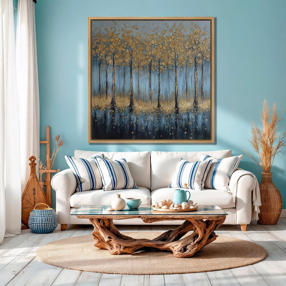 Framed Wall Art: Gold trees canvas print in a coastal living room. Blue and gold abstract art adds a touch of elegance. Perfect for modern home decor.
