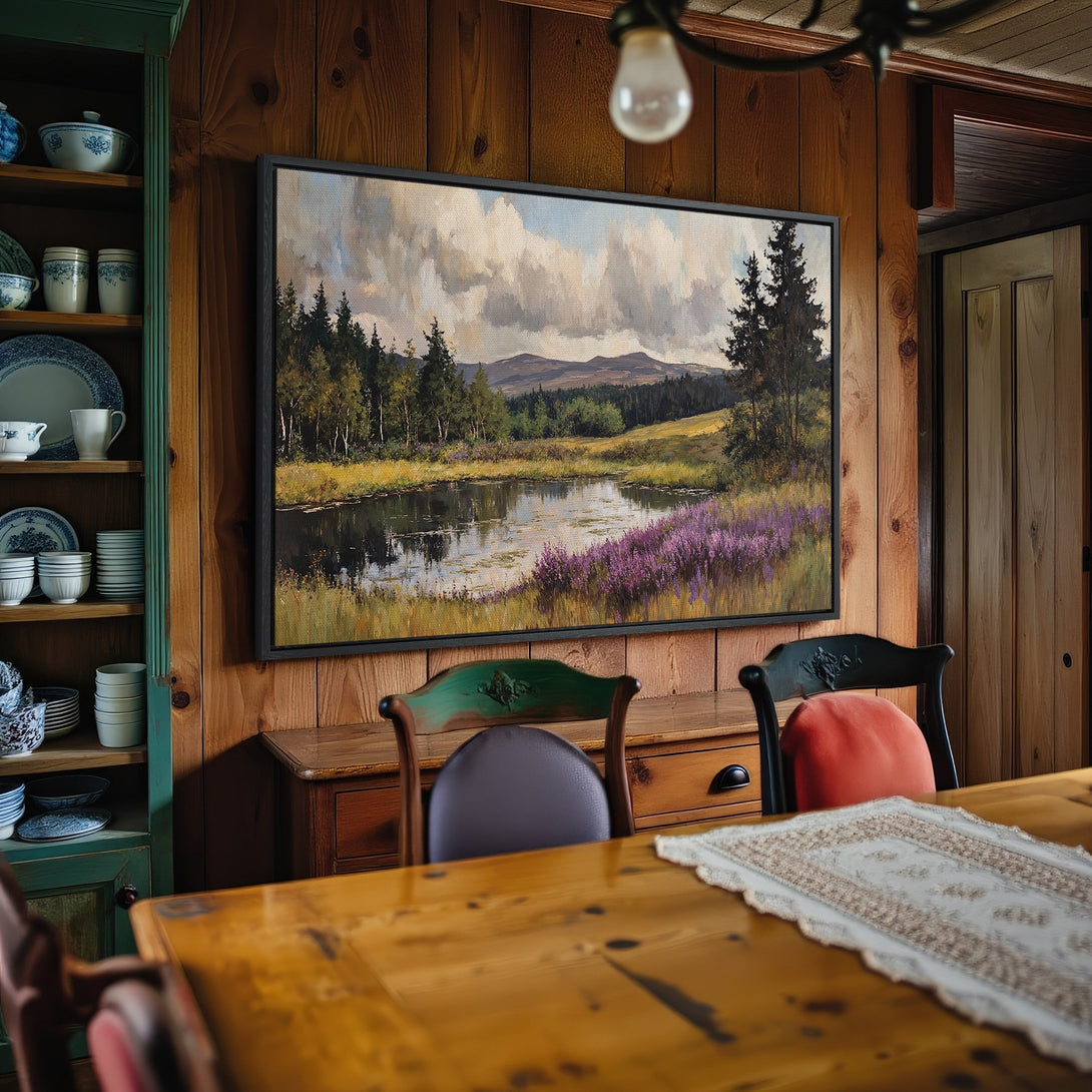 Framed Wall Art: Landscape canvas print with lake and mountain scene. Earthy tones and vibrant purple flowers create a warm, inviting aesthetic.
