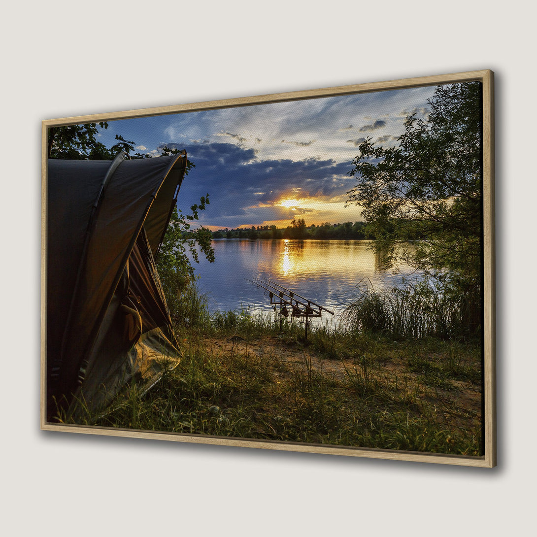 Framed Wall Art: Sunset over lake with fishing rods. Serene landscape Canvas Print in warm tones of gold, blue, and green. Peaceful decor.