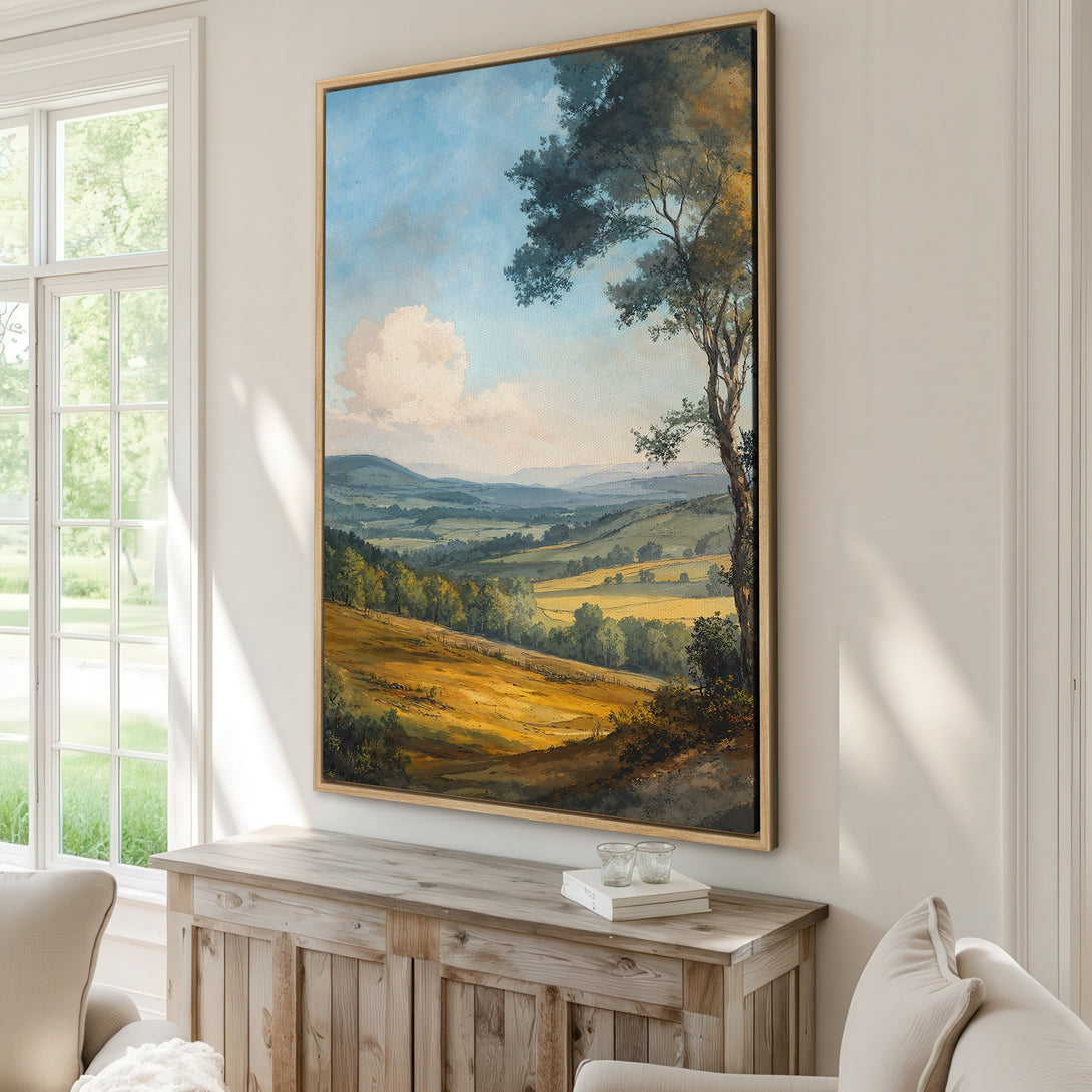 Framed Wall Art of a serene landscape with rolling hills and trees. Warm, earthy tones and a blue sky create a calming atmosphere. Perfect for any home!