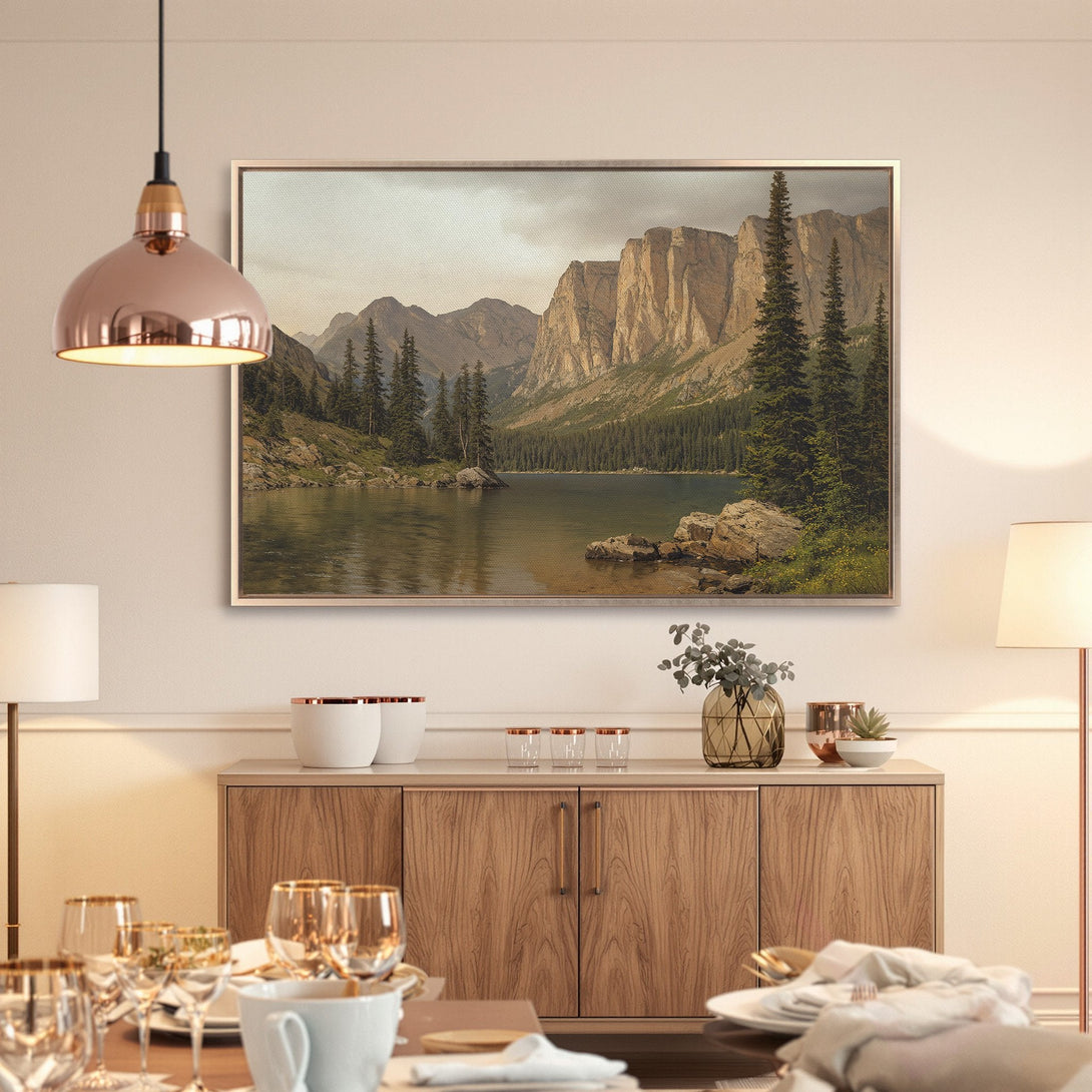 Framed Wall Art featuring a serene mountain lake scene. Earthy tones and a classic style create a calming ambiance for any space.