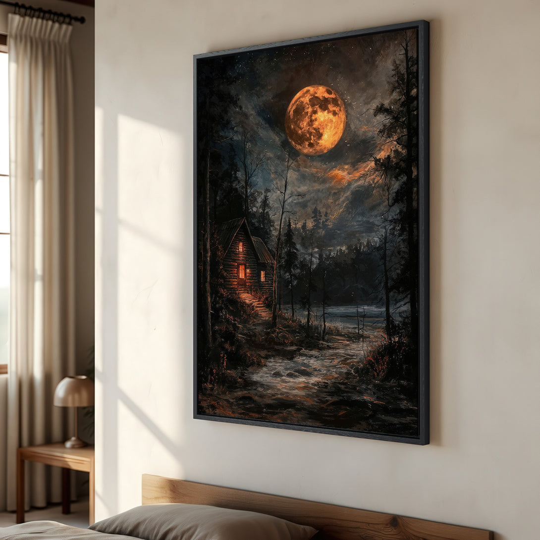 Framed Wall Art of a cabin scene under a vibrant moon. Dark, moody painting with warm orange and cool blue tones. Perfect for adding a touch of nature to your space.