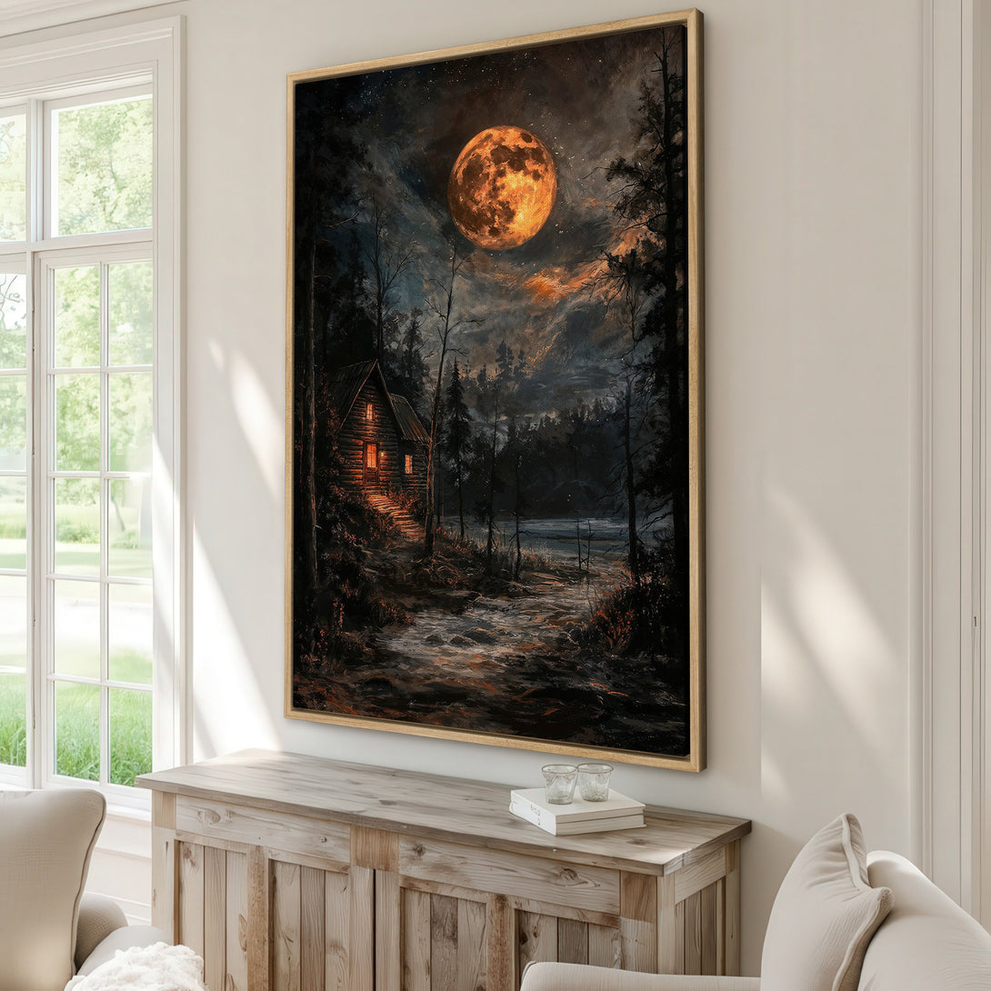 Framed Wall Art: Dramatic landscape Canvas Print of a cabin under a full moon. Dark, moody art with warm orange and cool blue tones. Perfect for cozy interiors.