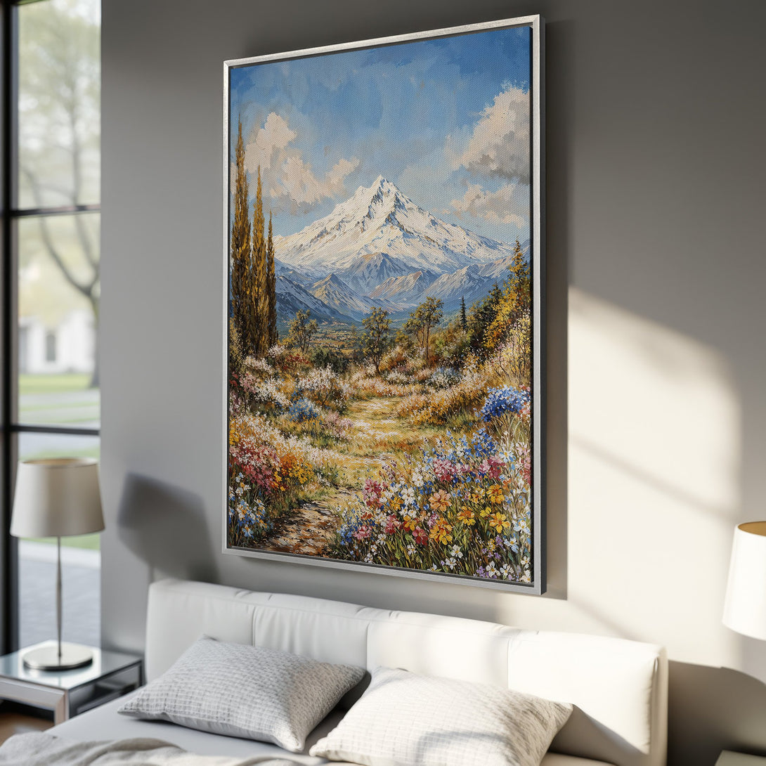 Framed Wall Art: Mountain landscape canvas print with vibrant floral foreground. Impressionistic style, featuring blues, greens, yellows, and whites. Perfect for any interior.