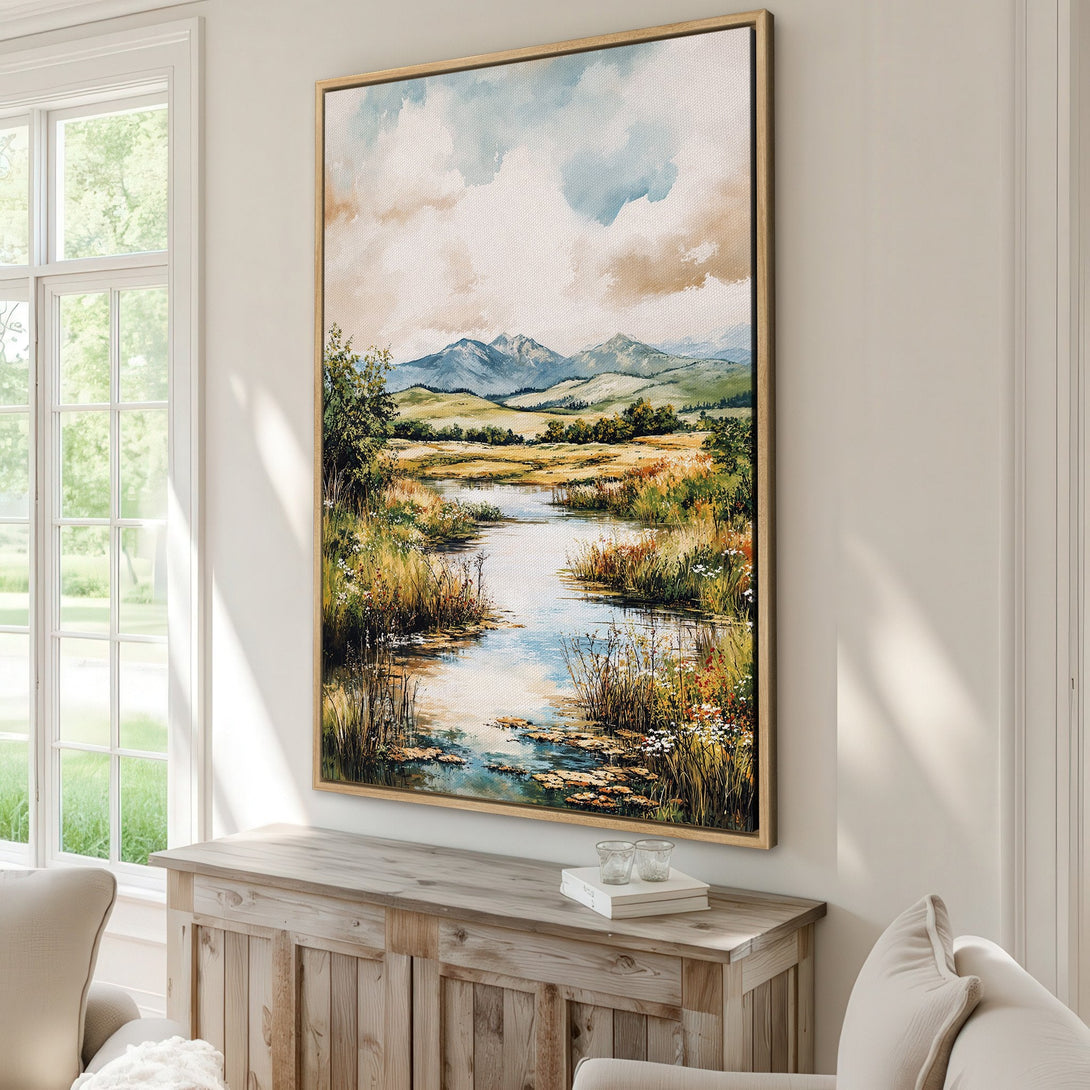 Framed Wall Art: Landscape Canvas Print featuring a serene river scene with mountains, lush greenery, and a warm, earthy color palette. Perfect for adding a touch of nature.