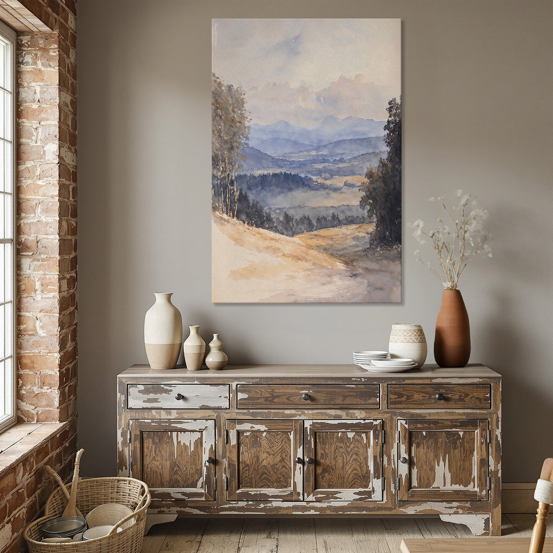 Framed Wall Art: Watercolor landscape Canvas Print in a dining room. Soft blues, beige, and gold tones create a serene and inviting atmosphere.