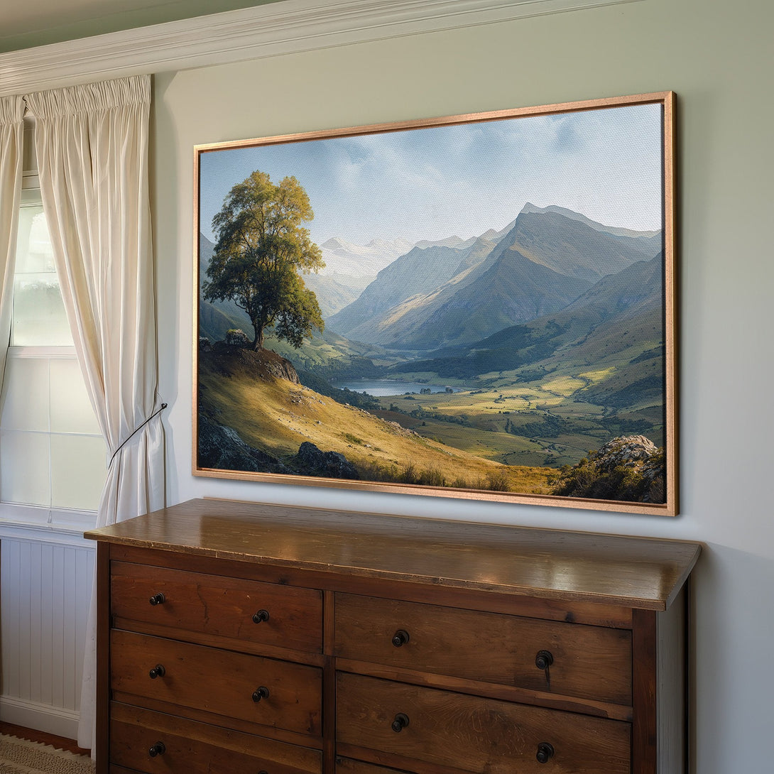 Framed Wall Art of a serene mountain landscape with a tree. Earthy tones of green, brown, and blue create a calming aesthetic. Perfect for home decor.