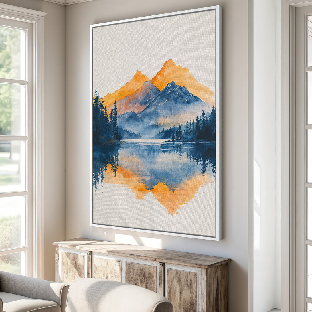 Framed Wall Art featuring a watercolor landscape of mountains and a lake. Blue and orange color palette, perfect for adding a touch of nature to your home.