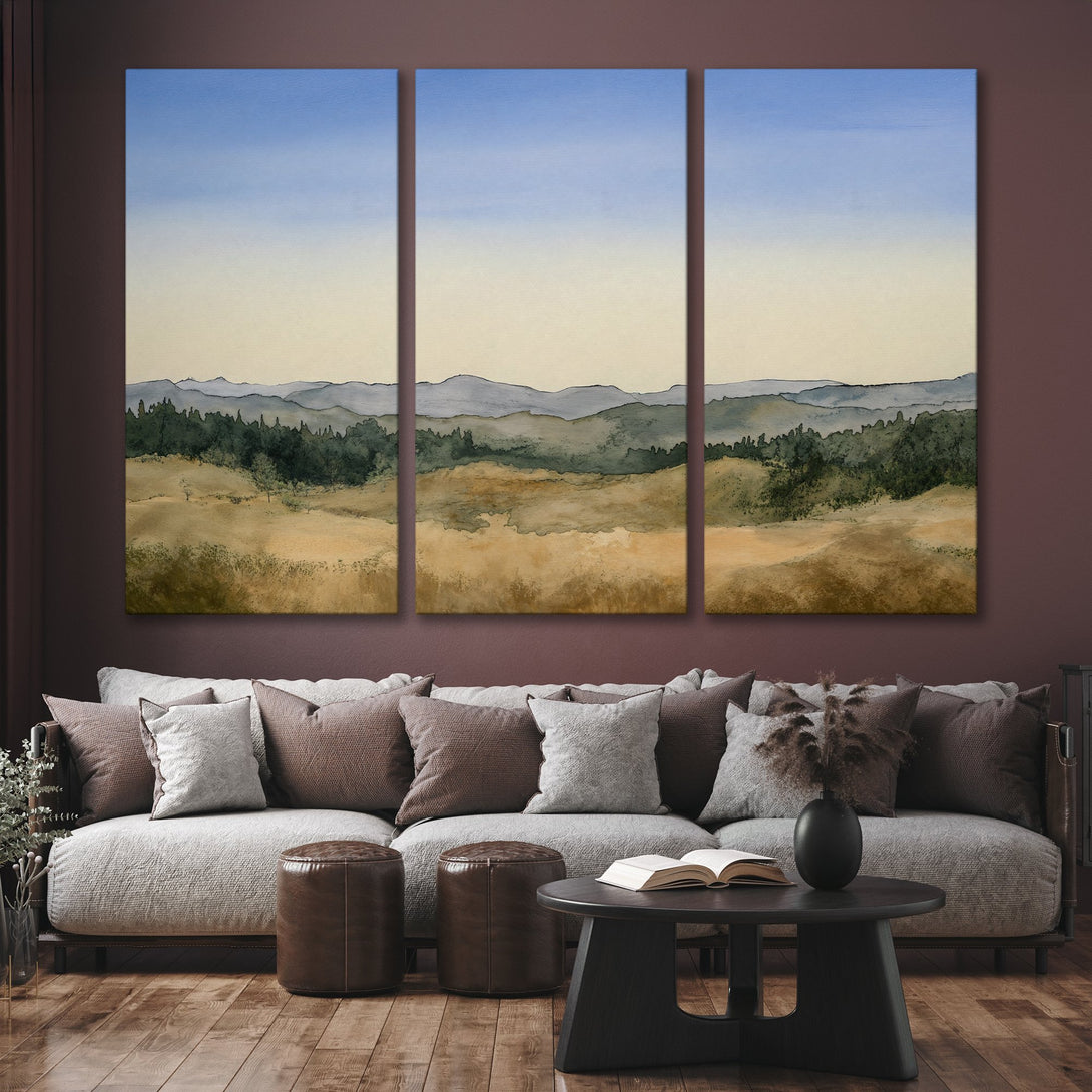 Watercolor Canvas Print of a serene landscape in muted blues, greens, and golds. Perfect wall art for a calming living room.