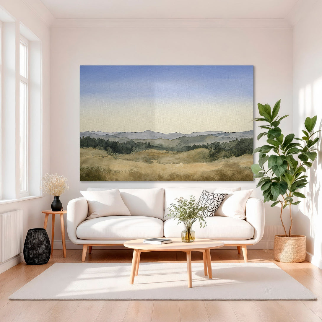 Framed Wall Art: Watercolor landscape print in gold frame. Earthy tones of blue, green, and beige. Perfect for modern home decor.